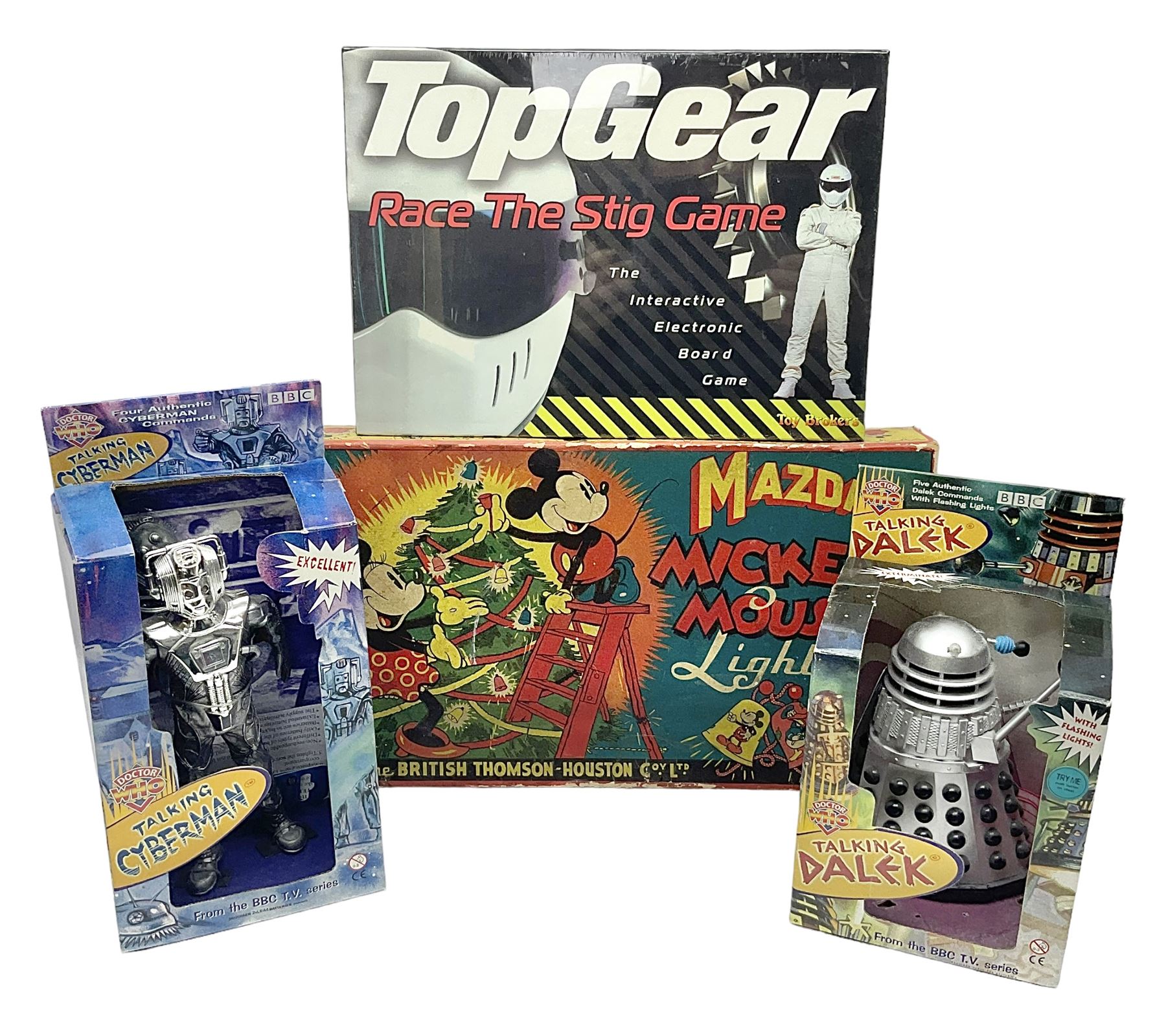 Mazda Mickey Mouse Lights by The British Thomson-Houston Co. Ltd.; boxed; unopened Top Gear Race The Stig game; Dr. Who Talking Cyberman; and Dr. Who Talking Dalek; both boxed (4)