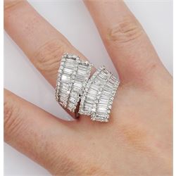 18ct white gold baguette and round brilliant cut diamond crossover ring, stamped, total diamond weight 3.25 carat