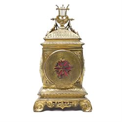 Early 20th century mantel clock with white enamel dial, French timepiece movement and recoil anchor escapement in brass case with lyre finial, trailing garlands and wreaths etc on scroll feet H30cm 
Provenance: property of a Nobleman