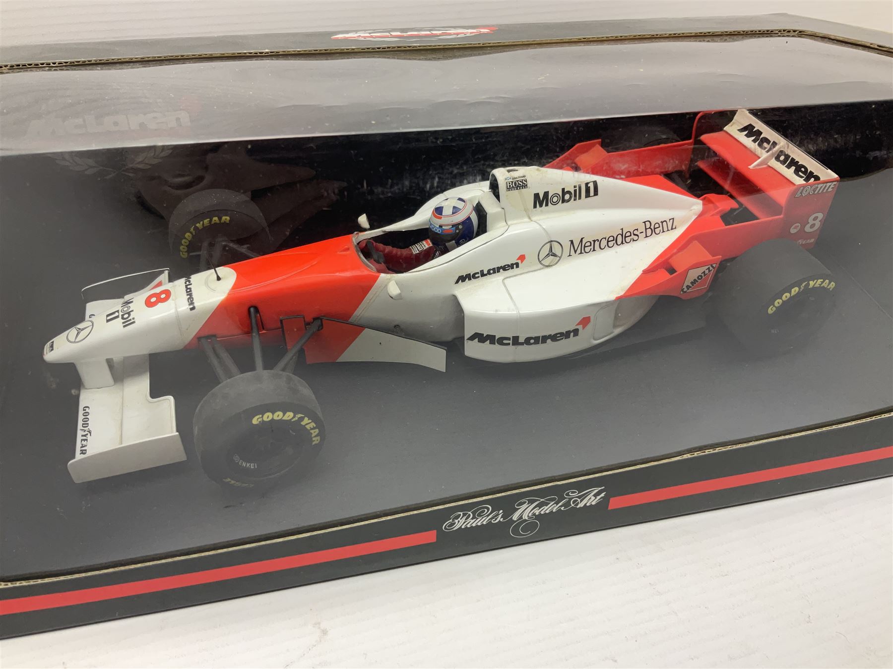 Three Paul's Model Art 1:18 scale die-cast McLaren racing cars - Mercedes MP4/11 D. Coulthard; MP4/4 A. Prost; and Mercedes MP4/10 M. Hakkinen; all boxed (3)
