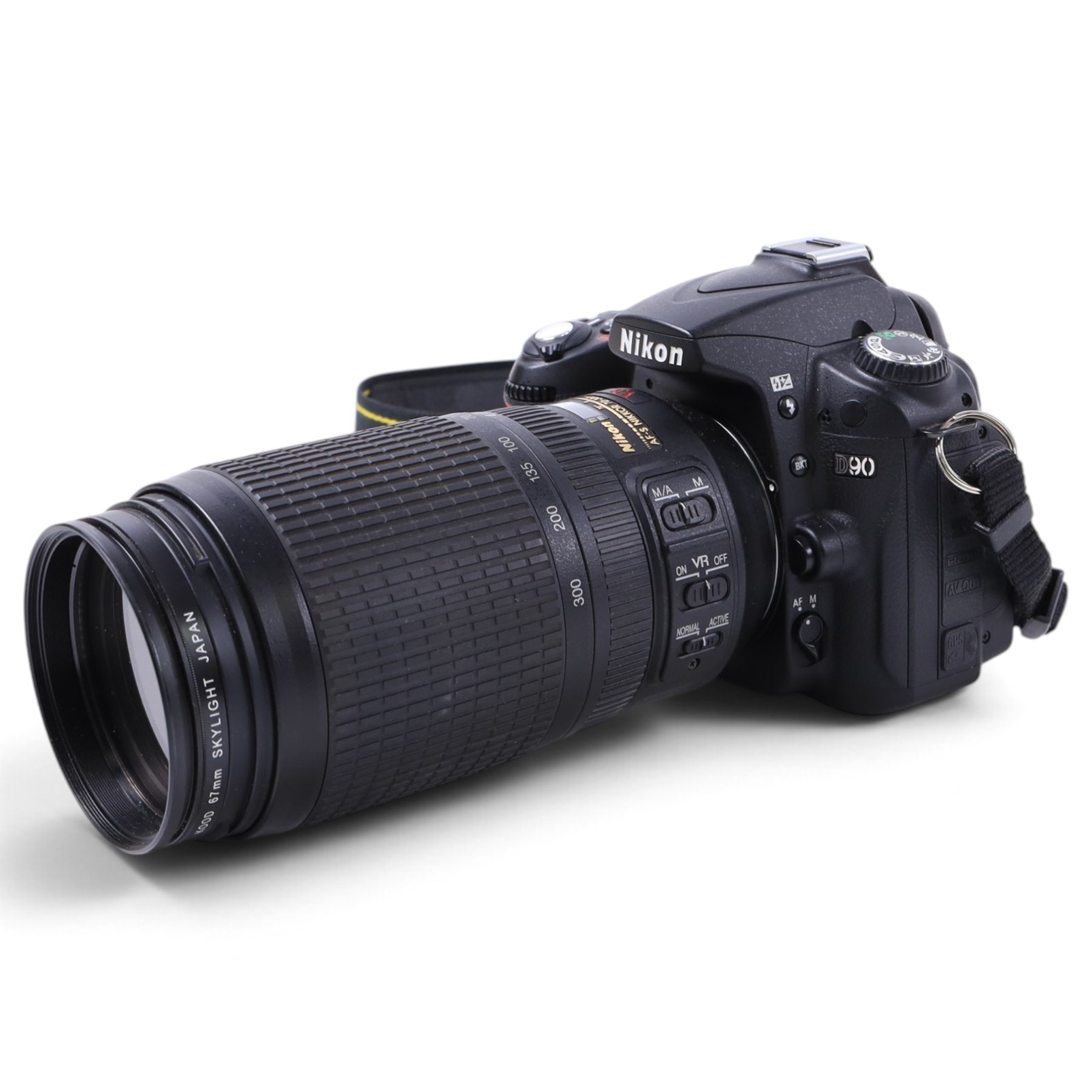 Nikon D90 DSLR camera body, serial no. 8230680, with a Nikon ED AF-S Nikkor 70-300mm 1:4.5-5.6 G lens, serial no. 3102829, with battery and Nikon Quick Charger, in carry case with other accessories including hoods, caps and filters