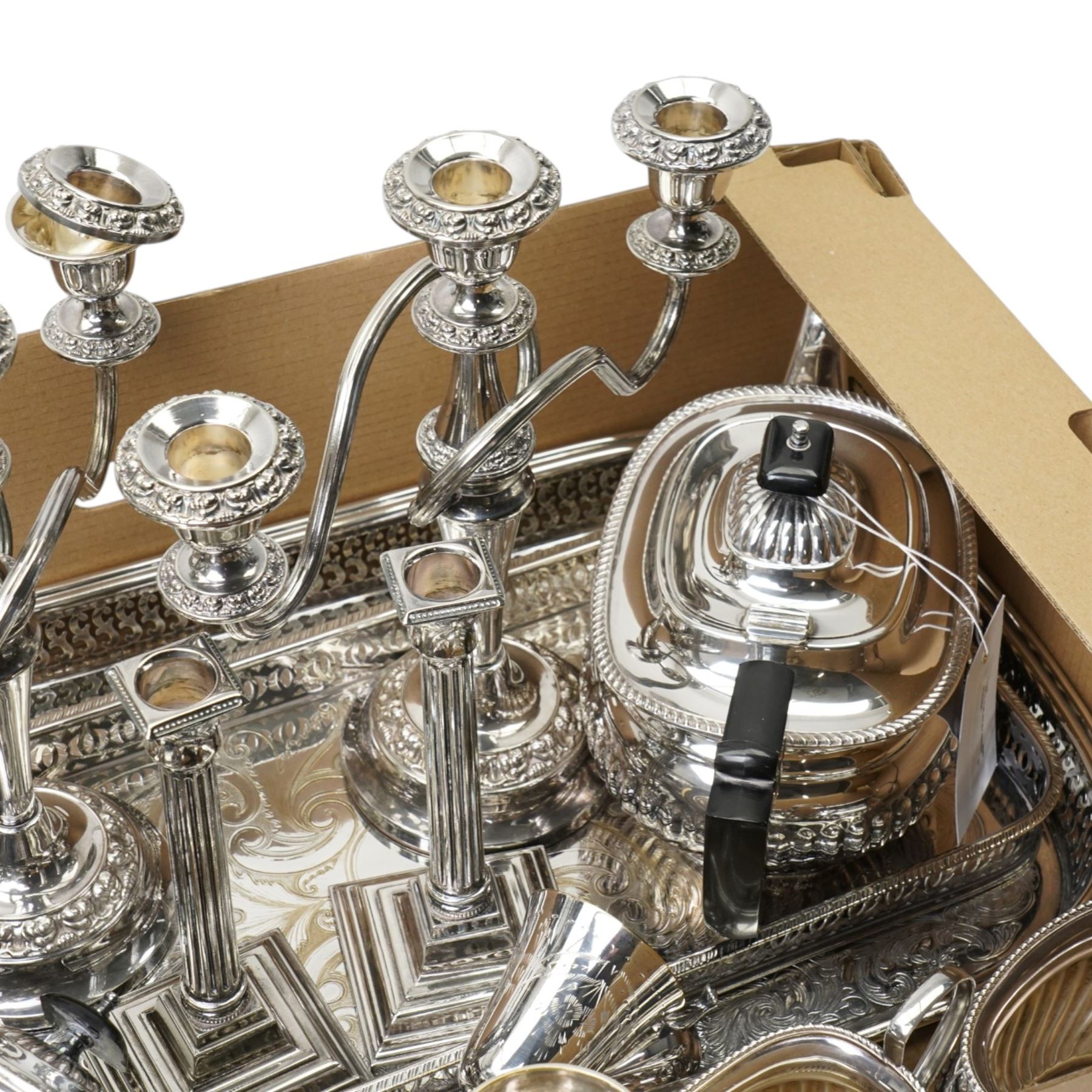Silver plated items including four piece tea set, pair of candelabra, pair of candlesticks, sugar bowl and cream jug with silver spoon etc