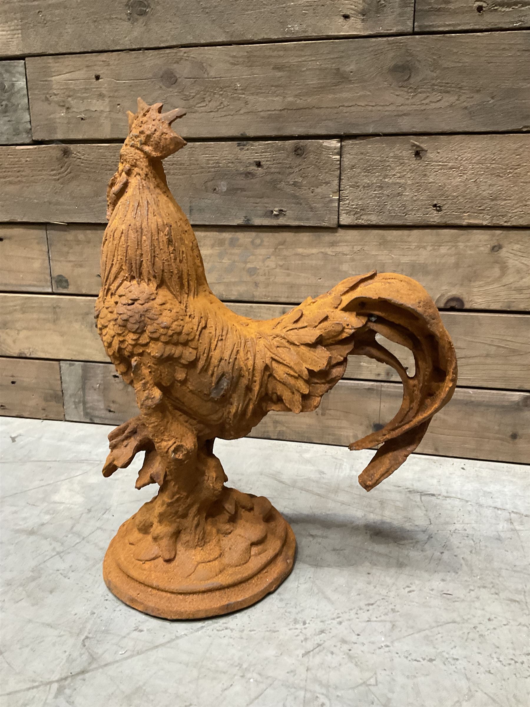 Small weathered cast iron garden cockerel