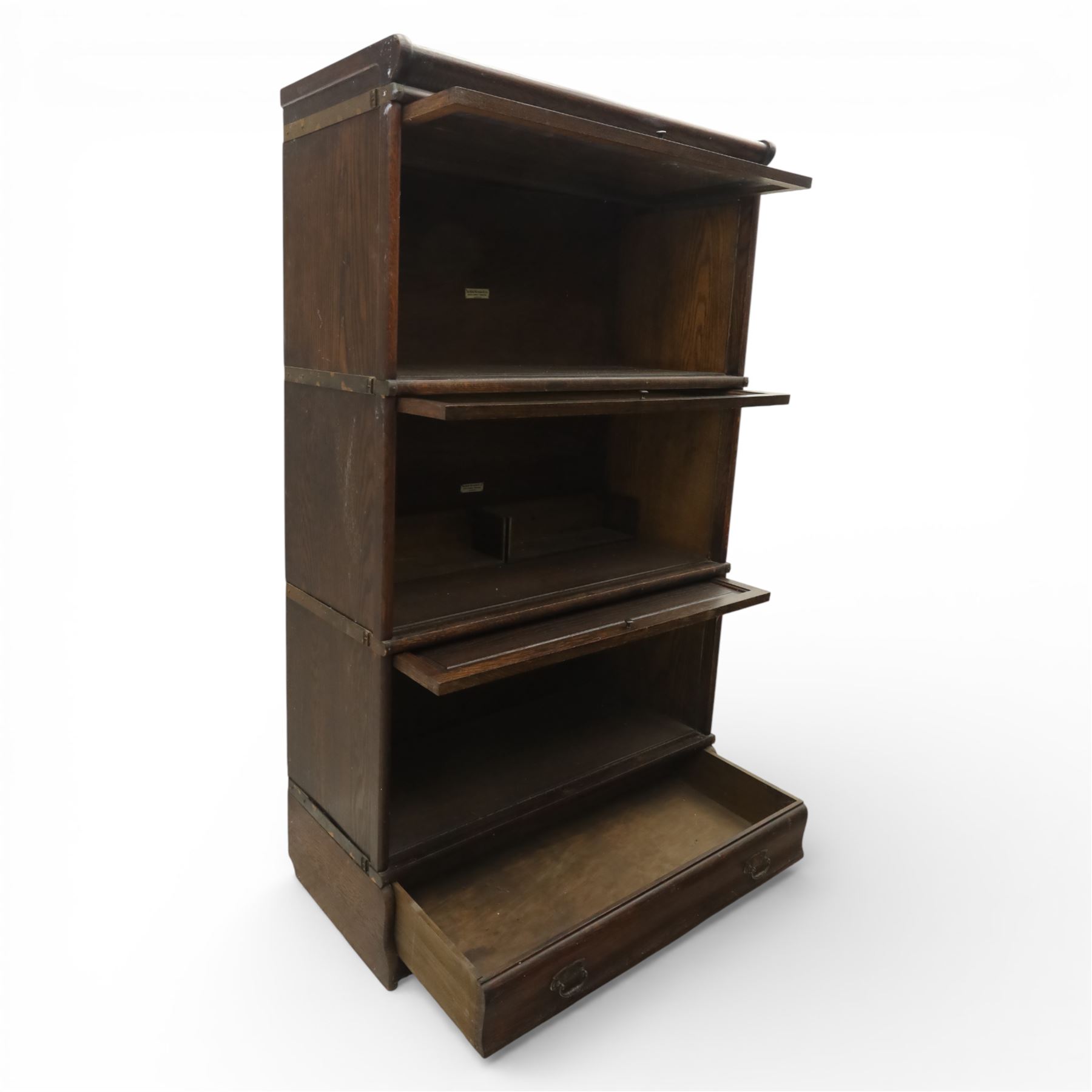 Globe Wernicke - early 20th century three sectional stacking library bookcase, two glazed sections above a panelled section, on a plinth base with inbuilt drawer