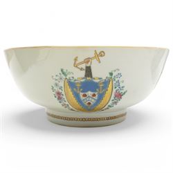 Chinese export Armorial part service decorated with sprays of flowers and a crest of an arm holding an anchor comprising bowl D23cm, pair of octagonal plates 16cm and sparrow beak jug H12cm (4)