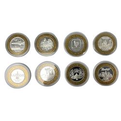 Eight Las Vegas limited edition ten dollar casino silver strike gaming tokens, consisting of a fine silver centre with brass outer ring (8)