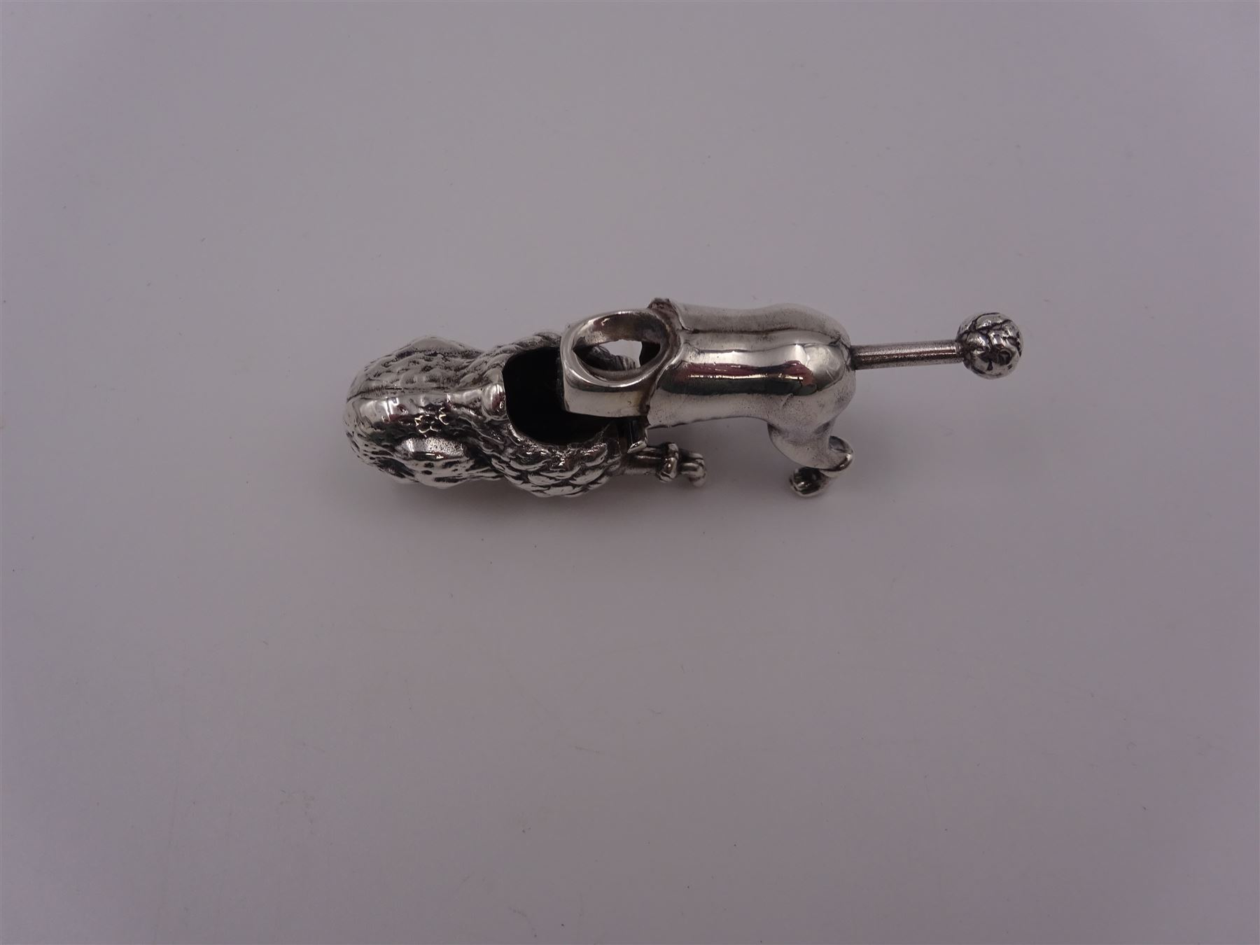 Modern silver novelty cigar cutter, modelled as a poodle, hallmarked, H4cm
