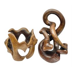 Helen Skelton (British 1933 – 2023): Two carved wooden abstract sculptures, one modelled as a entwined knot, largest H48cm. Born into an RAF family in 1933 in Kent and travelled the world extensively during her childhood. After settling in Bridlington, Helen immersed herself in painting, textiles, and wood sculpture, often inspired by nature's beauty. Her talent was showcased in a one-woman show at Sewerby Hall and recognised with the sculpture prize at Ferens Art Gallery in 2000. Sadly, Helen’s daughter passed away from cancer in 2005. This loss inspired Helen to donate her sculptures to Marie Curie upon her passing in 2023.
