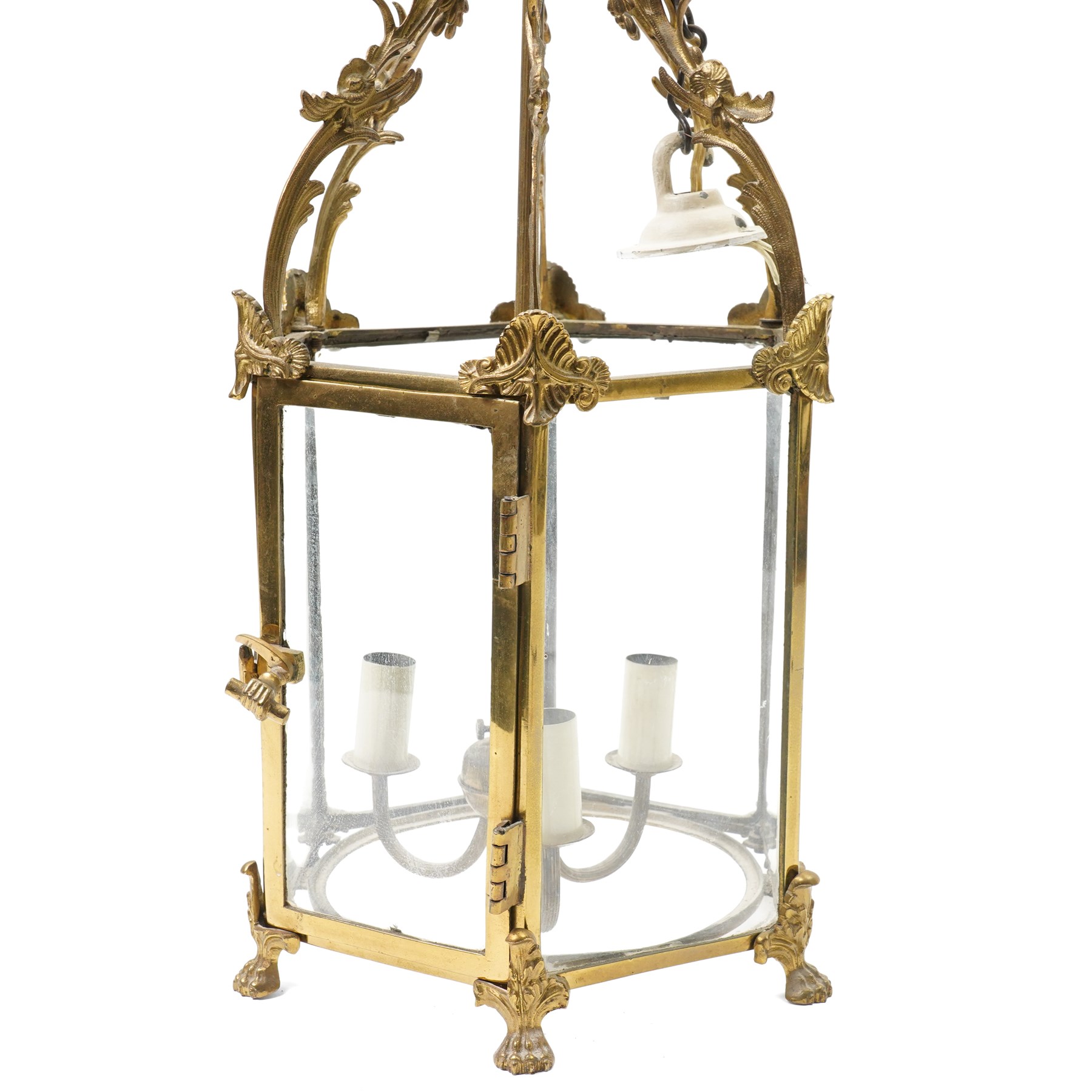 Three light hall lantern in metal and glass case, of hexagonal form, with classical decoration including a hand holding scroll handle, drop 72cm