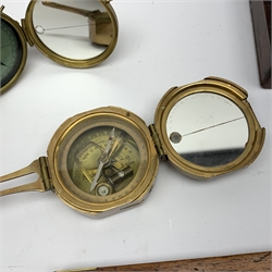 Brass Natural Sine type compass with spirit levels to the dial, bears name of Stanley, D8cm, in earlier mahogany box; brass pocket sextant of drum shaped form, the screw top marked Stanley London; small brass cased compass with pedestal tripod base; and Glass Developments Ltd. hahogany and brass spirit level L31cm (4)