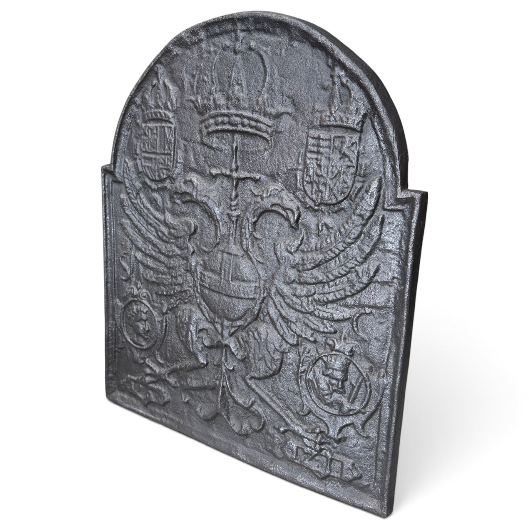 Early 20th century cast iron fireback, after an 18th century Flemish original, the arched plate cast in relief with the crowned Habsburg double-headed Imperial eagle and armorial shields of Charles V, Holy Roman Emperor