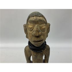 Early 20th century West African Yoruba family wooden figure of Orisha Oko, the god of farming/agriculture, carved from the solid, bears manuscript label of provenance verso H26.5cm