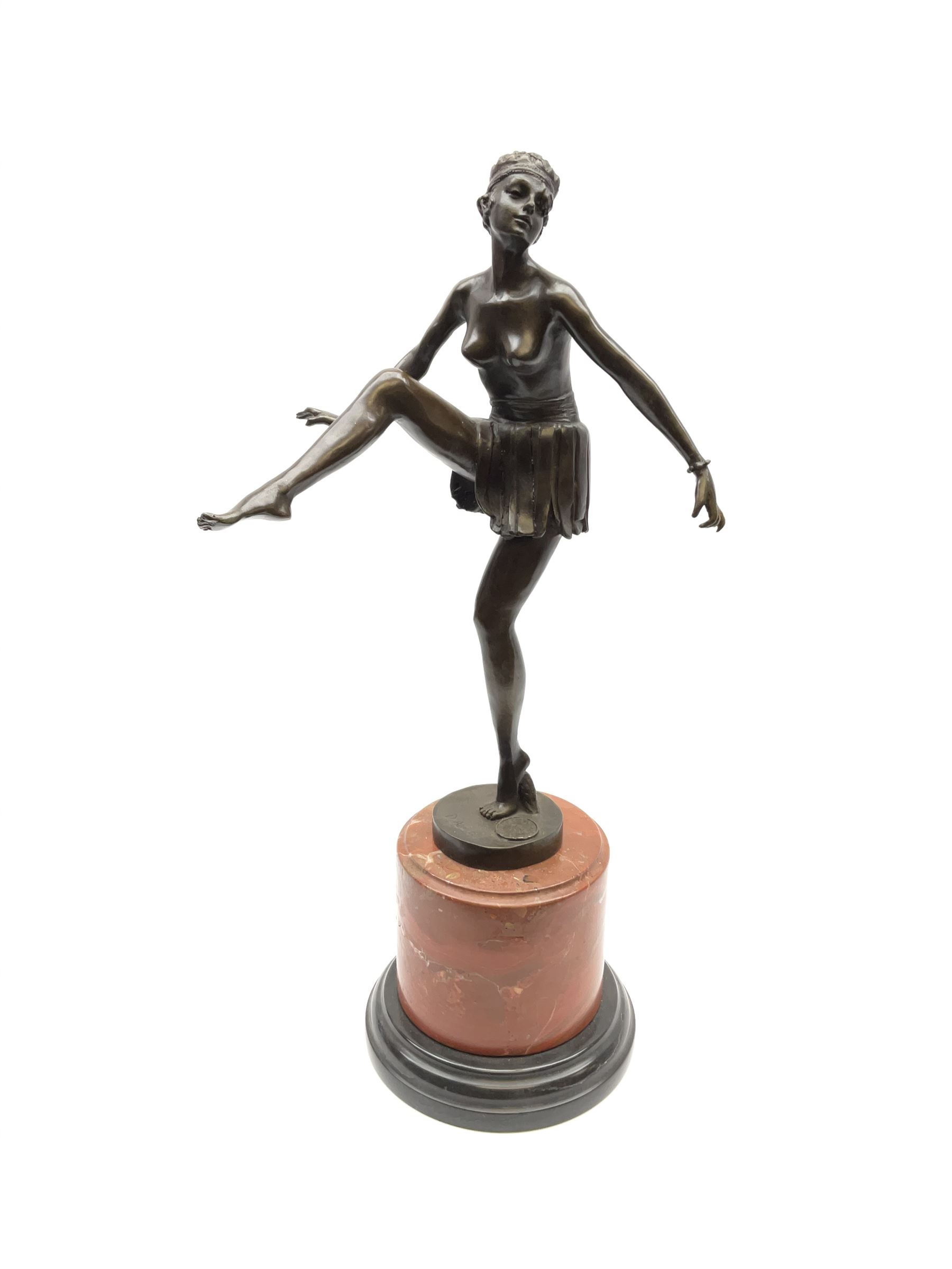 An Art Deco style bronze after D Alonzo, modelled as a dancer, with impressed mark and foundry mark, raised upon a cylindrical marble base, overall H47.5cm. 