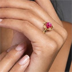 14ct gold ruby and diamond flower head ring, carved ruby set with a single round brilliant cut diamond, on a 9ct gold shank, hallmarked