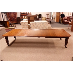 Large Victorian mahogany telescopic action extending dining table, moulded top with rounded corners, on lobed tapered supports with brass sockets and castors, with three additional leaves, L350cm, W137cm, H74cm max   