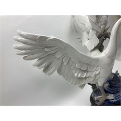 Large Lladro figure group, Swans Take Flight, modelled as two swans upon raised on circular wooden plinth, sculpted by Salvador Debon, H68cm