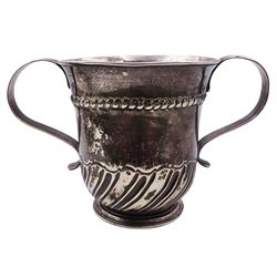 George II silver porringer, the part fluted body with twin curved strap handles, repousse decorated with a scroll and flower head reserve initialled WSB and rope border, hallmarked London 1755, makers mark probably Wm Shaw & Wm Preist, H11cm, approximate weight 8.89 ozt (276.4 grams)
