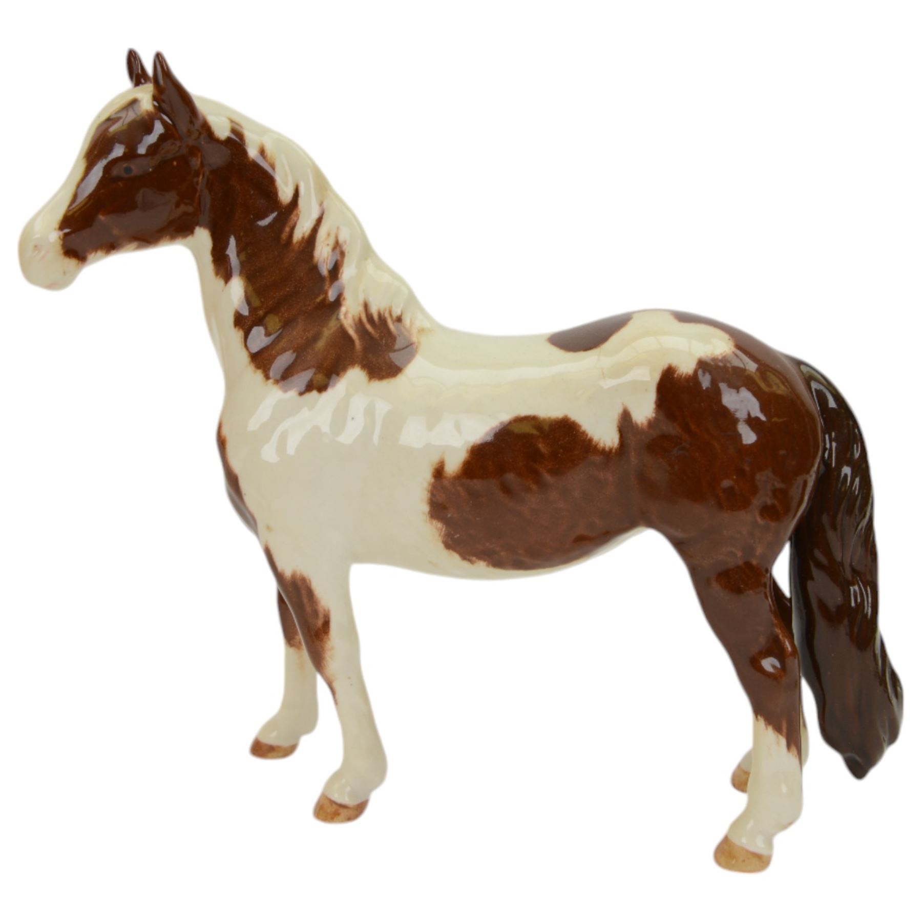 Three Beswick Horses, comprising skewbald Pinto Pony no 1373, Palomino horse and Palomino shetland