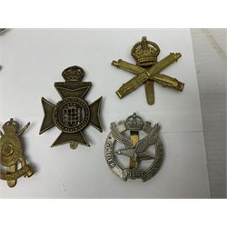 Twenty various cap badges including Rifle Brigade, Machine Gun Corps, Carabiniers, Kings Royal Rifle Corps, RAF, AAC, Glider Regiment etc