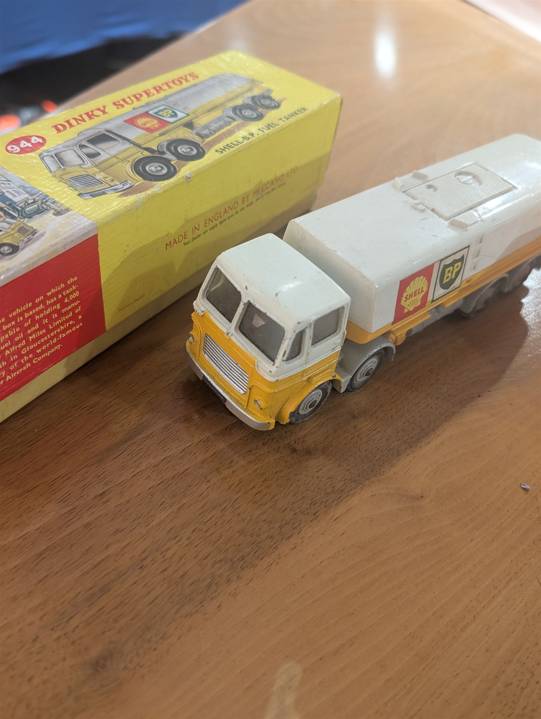 Three Dinky Toys diecast vehicles, comprising Field Marshall Tractor no. 301, Shell BP Fuel Tanker no. 944 and Snow Plough no. 958, all boxed