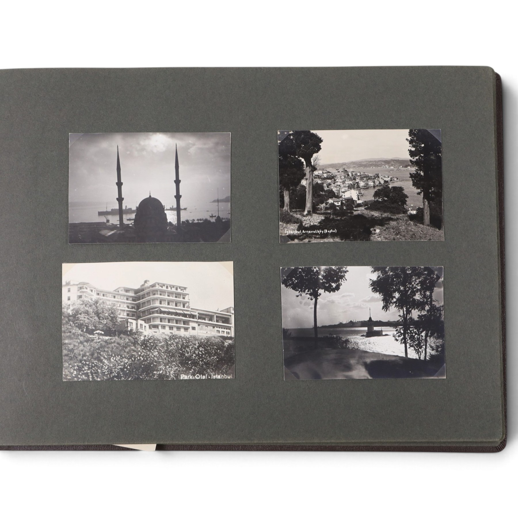 Two early to mid 20th century postcard albums, containing black and white and colour postcards of France, Turkey and Egypt, together with some personal photographs and newspaper clippings