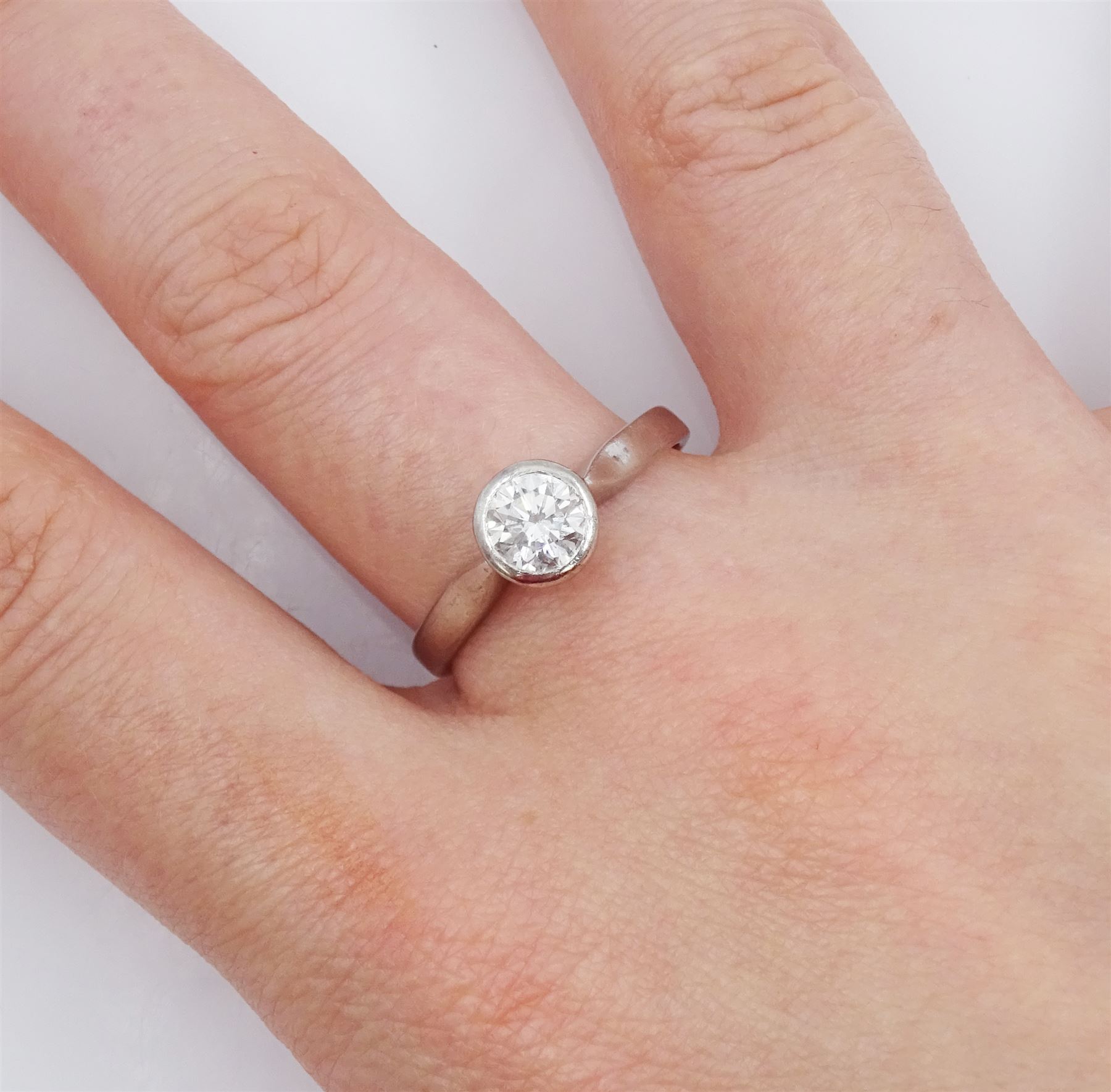 18ct gold bezel set single stone round brilliant cut diamond ring, Birmingham hallmark, diamond approx 0.65 carat