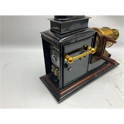 French magic lantern, in brass and black japanned tin case with carrying handles, four adjustable burners and height adjuster, on stepped wooden base L47cm
