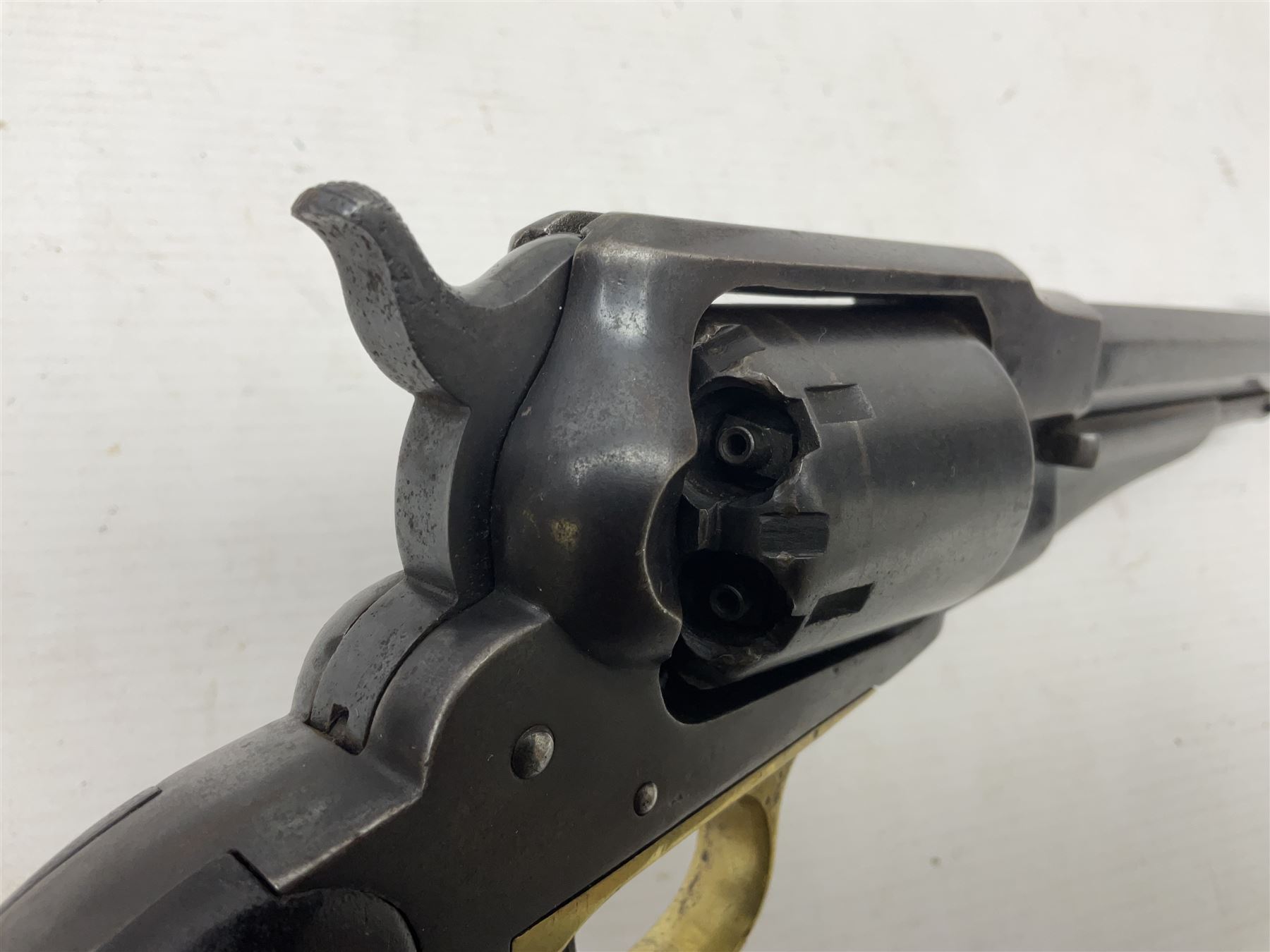 Unmarked Spencer & Rogers type Remington style .44 cal. six-shot percussion revolver, 20cm octagonal barrel with loading lever under, brass trigger guard and two-piece wooden grip L37cm overall; together with a framed watercolour by Alan J. Gray dated 2009 entitled 'The Remington .44 Calibre 1861 Navy Revolver'  19 x 42cm (2)