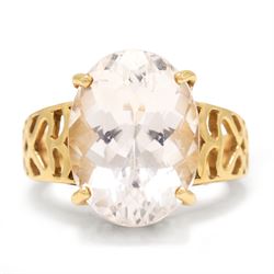 9ct gold kunzite ring, four claw set with a single oval cut kunzite, pierced design galler...