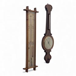 Two mercury barometers, comprising an early 20th-century Admiral Fitzroy storm barometer in an oak case and a late 19th-century carved rosewood wheel barometer with thermometer, 24cm silvered dial signed Atkinson, Carlisle, 17.5x104cm & 109x33cm