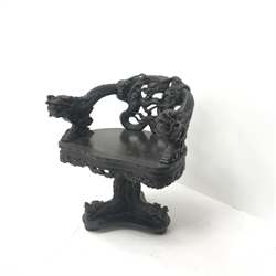  Chinese style heavily carved ebonised office swivel chair, W62cm  