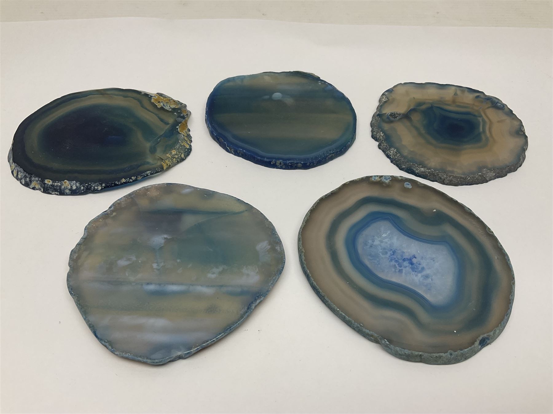 Five blue agate slices, polished with rough edges, H9cm, L7cm