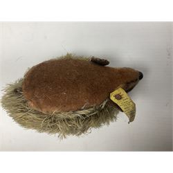 Group of Steiff figures, comprising Mikki and Mukki, circa 1950s no 7628/12 and 7627/12, with original tags, two hedgehogs no 1570/10, and another smaller 1670/03, small owl no 7480/06, and painted metal Steiff harlequin style bear