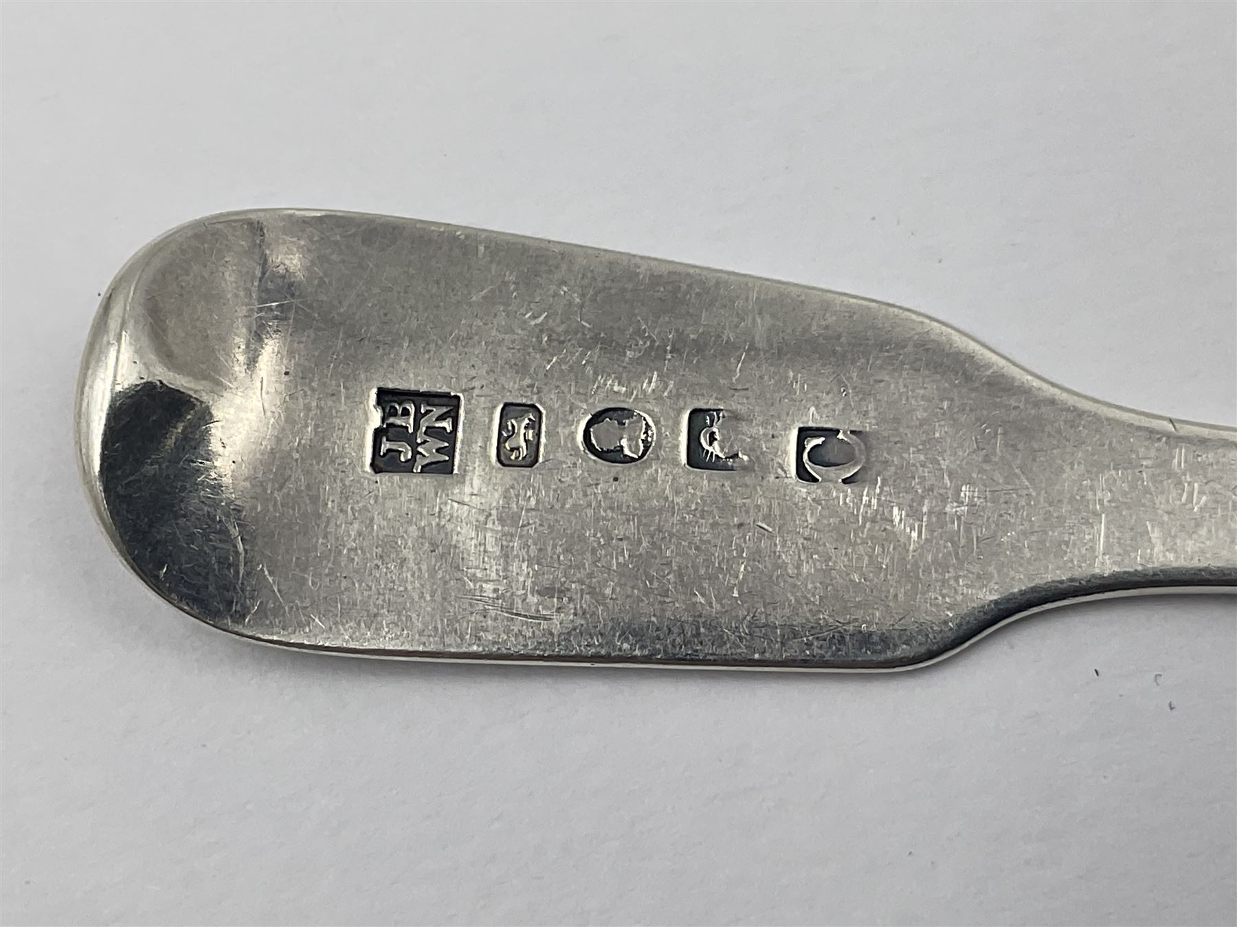 Pair of George III York silver Fiddle pattern dessert spoons, each engraved with a rampant lion crest, hallmarked James Barber & William North, York 1789