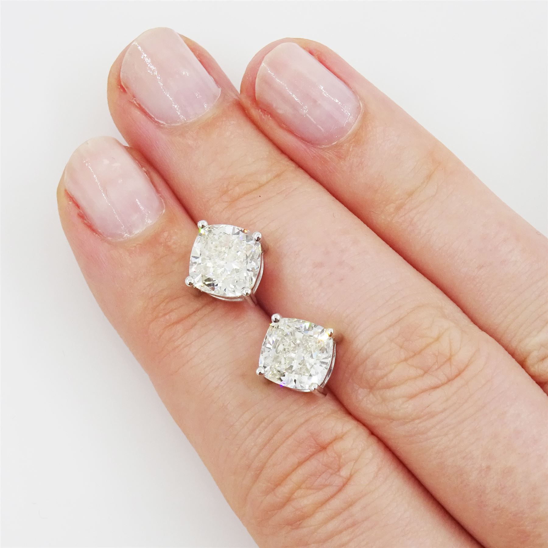 Pair of 18ct white gold cushion cut diamond stud earrings, stamped, total diamond weight, 4.48 carat, each diamond with GIA certificate