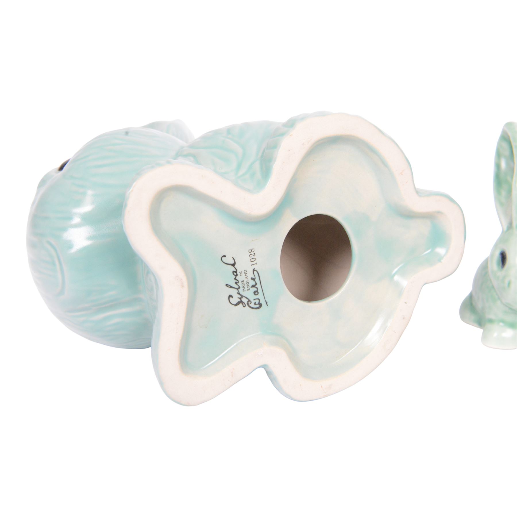 Nine Sylvac rabbits, including models 1028, 990, 1026 etc, in blue and green, largest H25cm  