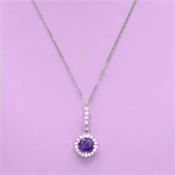 Early 20th century white gold silver amethyst and diamond pendant, round cut amethyst, surrounded by seventeen old cut diamonds, suspending from a five stone diamond set bail, to a silver chain necklace, total diamond weight approx 0.40 carat