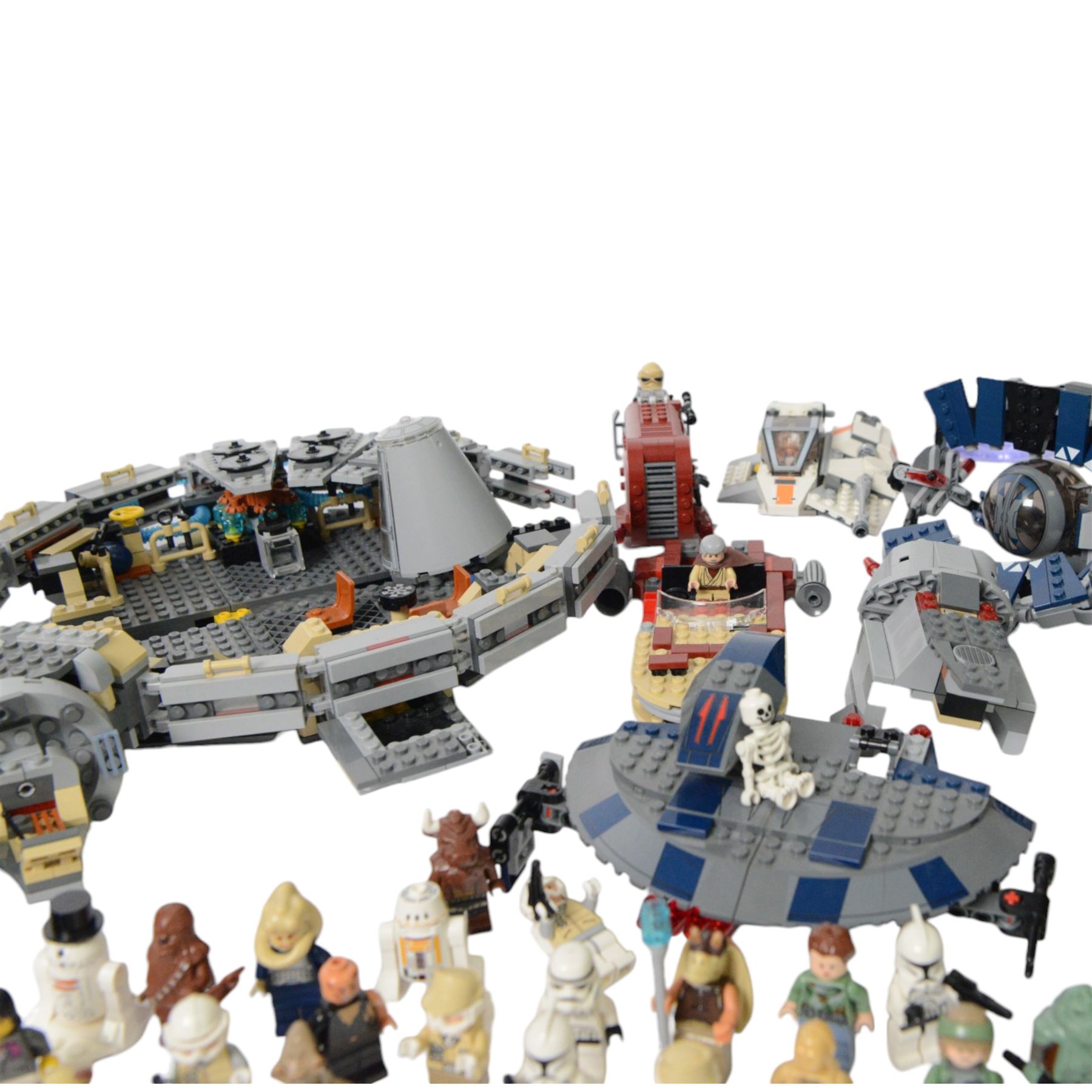 Collection of partially built Lego Star Wars models, including Motorized Walking AT-AT no. 10178, Hyena Droid Bomber no.8016, Emperor Palpatines Shuttle no. 8096, Jabbas Palace no. 4480 and Millennium Falcon no. 4504, etc together with a quantity of Lego Star Wars minifigures, loose parts and instruction booklets for Lego Star Wars sets