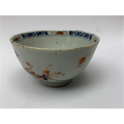 Group of 18th century Chinese tea wares, comprising tea bowl and saucer decorated with peonies, two birds and fence, tea bowl and similar saucer decorated in prunus blossom, two saucers decorated in the Mandarin style with figures conversing, blue and white saucer, and two coffee cups