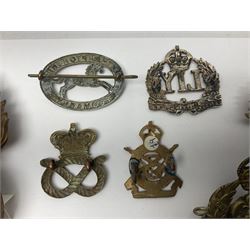 Nineteen Yeomanry metal cap badges including Derbyshire, Northamptonshire, Essex, Glamorgan, Staffordshire, City of London, Surrey, Shropshire, Hertfordshire etc; together with eleven Fusiliers badges including Lancashire, Royal Welch, Northumberland etc (30)