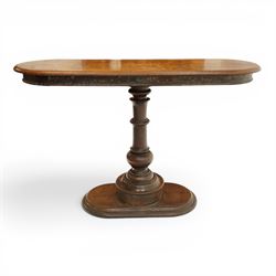 Georgian mahogany console table, the top of oval form, above a turn vasiform column, above an oval plinth base 