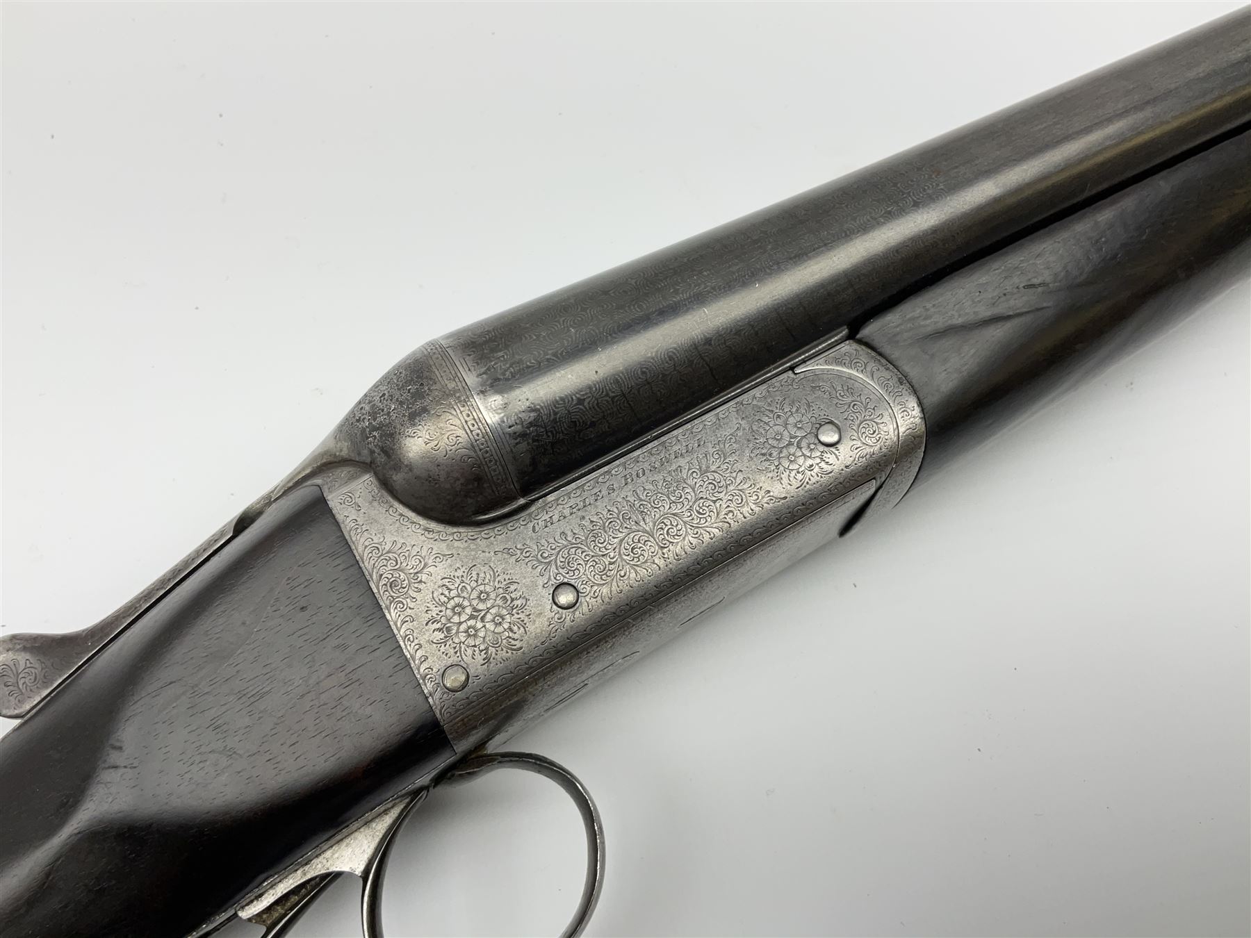 Charles Boswell 12-bore side-by-side double barrel box-lock non-ejector sporting gun, with 71.5cm sleeved barrels, thumb safety, walnut stock with chequered grip and fore-end, serial no.12720, L112.5cm overall SHOTGUN CERTIFICATE REQUIRED