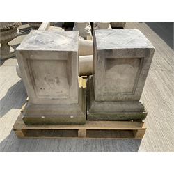 Set of four cast stone architectural columns, tapering form, on square plinth bases