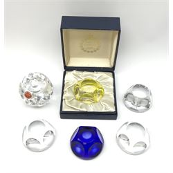 A group of six Webb Corbett faceted glass paperweights, to include one blue example, and one yellow example in makers box. 