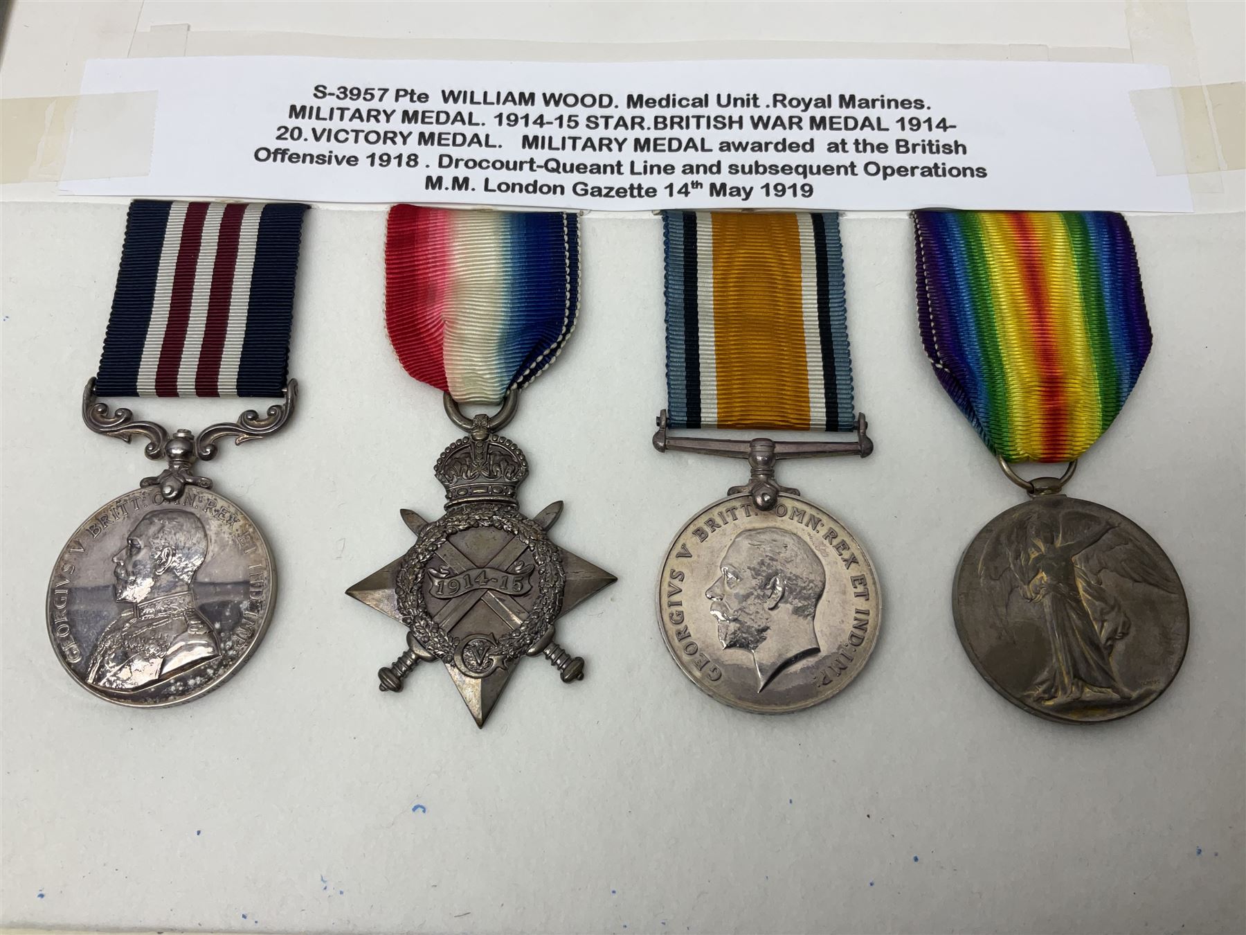 WWI Military Medal awarded to S-3957 Pte. W. Wood Med. Unit R.M. as reported in the London Gazette 14th May 1919 for services at 'the British Offensive 1918 Drocort-Queant Line and subsequent Operations' with archive of research information and original bill of purchase from Spink & Son dated 5/9/1957; together with a WWI group of three medals comprising British War Medal, Victory Medal and 1914-15 Star awarded to 1732 Pte. D. Newton R.A.M.C.