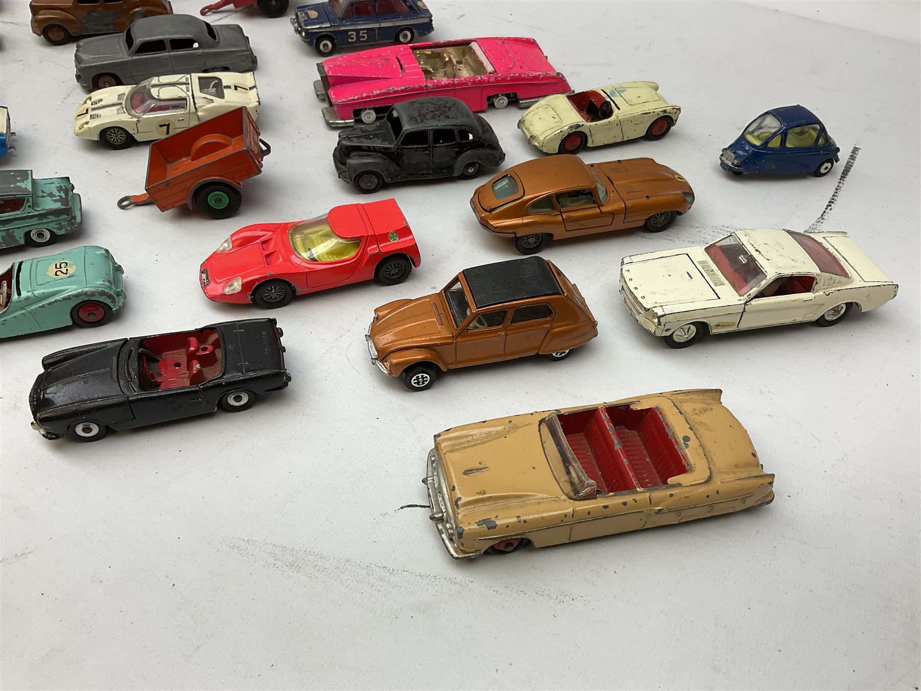 Dinky - twenty-five unboxed and playworn die-cast models including Lady Penelope FAB1, Caravan, Ford Sedan, Triumph TR2, Packard, Austin Somerset, Devon, Healey and Seven Countryman etc (25)