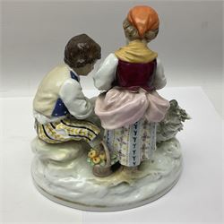 Two 19th century german figures, each modelled as children feeding birds, H19cm 