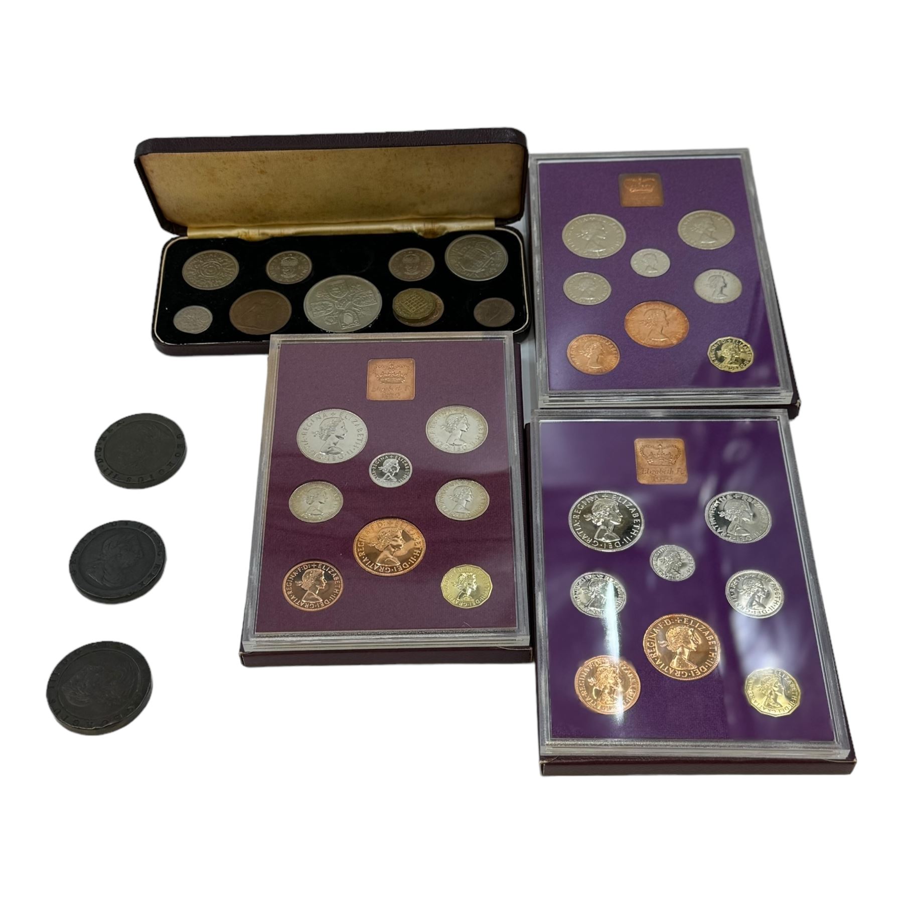 Three George III 1797 cartwheel twopence coins, Queen Elizabeth II 1953 ten coin set and three Great Britain and Norther Ireland 1970 proof coin sets