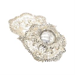 Pair of late Victorian silver bon bon dishes, of hexagonal form with embossed and pierced scrolling decoration, upon a circular pierced base, hallmarked Goldsmiths & Silversmiths Co, Birmingham 1893, W11cm, H4cm