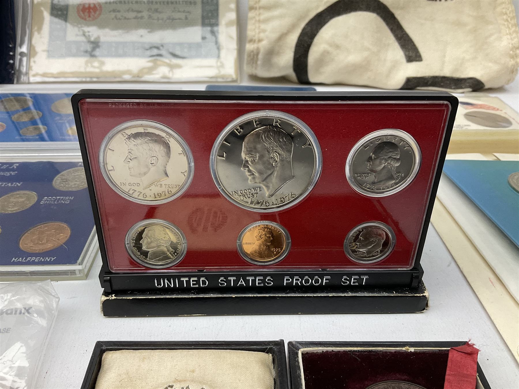 Great British and World coins, including Canadian 1975 dollar, United States of America 1975 proof set and bicentennial silver uncirculated set 1776-1976, Queen Elizabeth II Gibraltar 1977 sterling silver proof twenty-five pence, cased with certificate, New Zealand 1979seven coin set in blue wallet,  GB pre-decimal coins etc